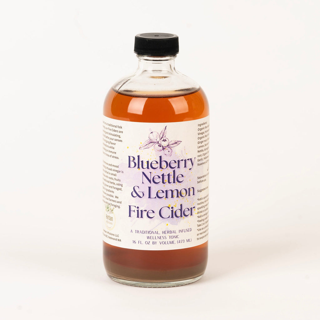 Bottle of Blueberry Nettle & Lemon Fire Cider on a white background